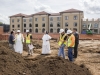 Ben Nance, archaeologist with the State of Tennessee, consults with Aquinas College adminsitration and construction crews at the site where the tombstones were uncovered
