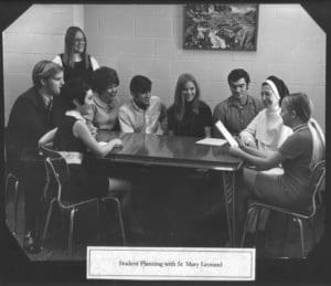 vintage photo of Sister Mary Leonard with students.