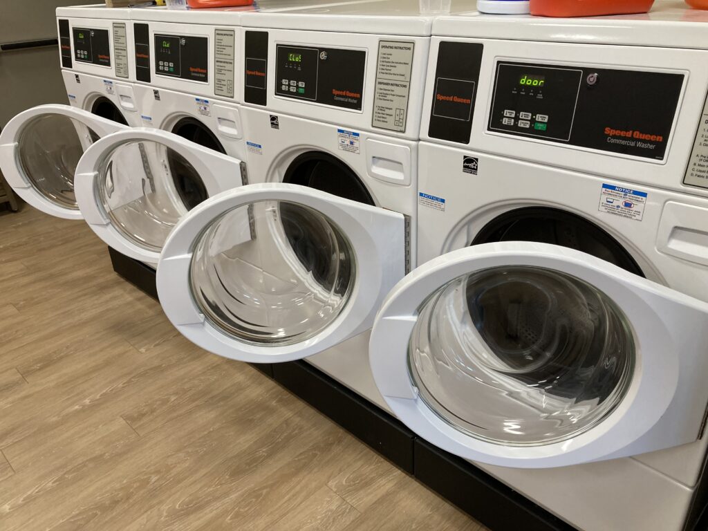 Commercial laundry area has four washers and dryers complimentary for guests to use.