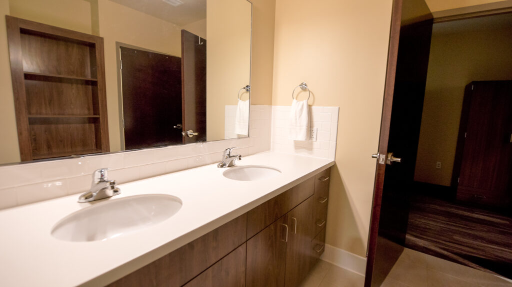 Attached to each bedroom is a shared bathroom featuring two sinks, a private toilet and private shower. Toiletries and towels are provided by the Siena Hall Conference Center.