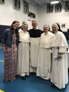 Magdalen Pozuc, '15 joins Br. Vincent Mary, '17 and Aquinas faculty and staff members Sr. Mary Madeline, Sr. Elizabeth Anne, and Sr. Matthew Marie in Cincinnati after the Mass