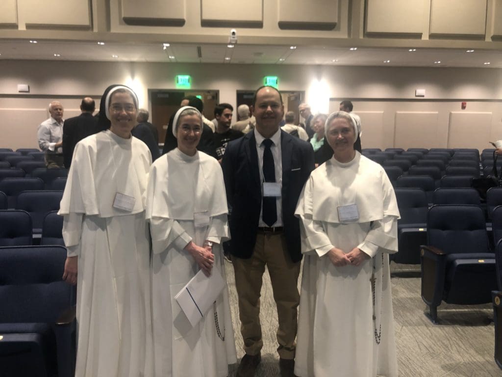 Sister Anne Catherine, Mother Anna Grace, Jason Gale, and Sister Mary Angelica attend Father Giertych’s keynote address.