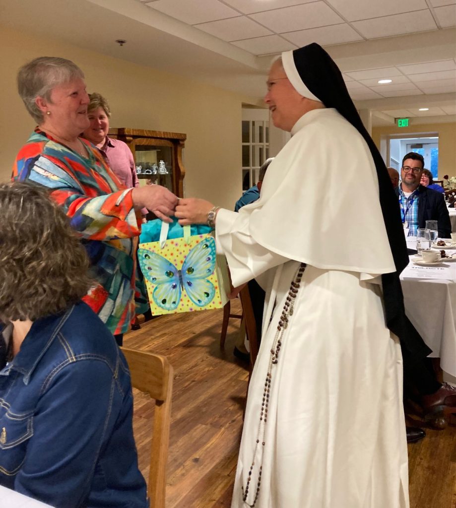 Past President of TAILACTE (Tennessee Association of Independent Liberal Arts Colleges of Teacher Education) presents Sister Matthew Marie, O.P. with a plaque, recognizing Sister for her “Distinguished Service and Dedication to TAILACTE”