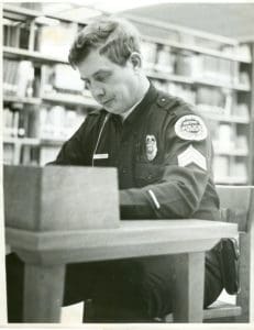 vintage photo of police officer studying
