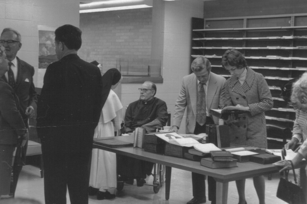 A reception in 1972 marking the donation by Msgr. George Flanigen of his personal library, papers, and research files to the college