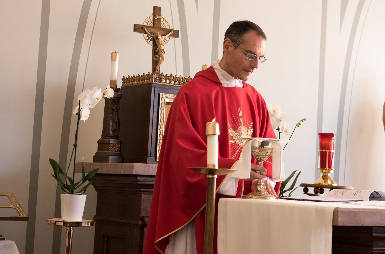 Fr. Chrismer praying Mass
